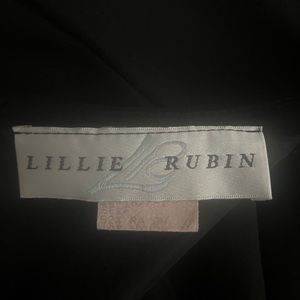 Long sleeve, rhinestone, backless gown.